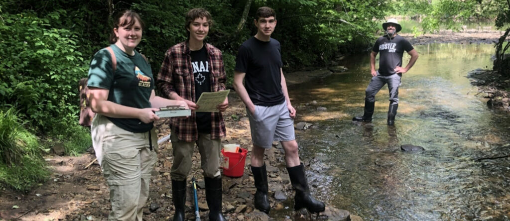 Students in river for Red Cedar Basin project